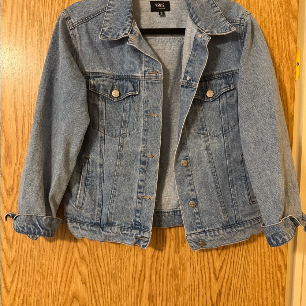 Denim jacket “cowboys” on back